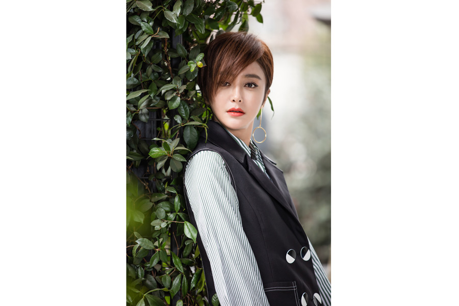 Actress Qin Lan poses for fashion magazine