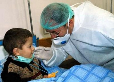 Turkish Minister of Health Recep Akdag visits Yusuf Has, who is under treatment for a suspected bird flu virus, at an hospital in the eastern Turkish city of Van January 8, 2006.