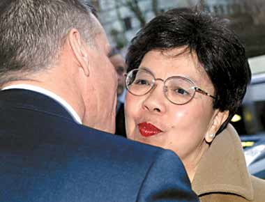 New WHO Director-General Margaret Chan is welcomed by outgoing WHO Acting Director-General Anders Nordstroem on her first day in office at the World Health Organization's headquarters in Geneva yesterday. Reuters