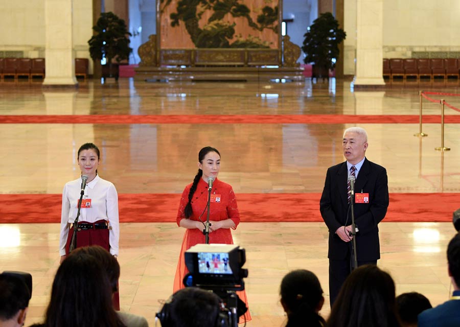 Delegates pick up questions at the Great Hall of the People