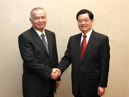 Hu meets with Uzbekistani president