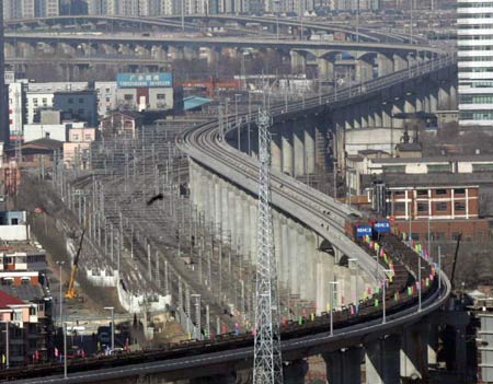Photo taken on Dec. 15, 2007 shows a segment of the Beijing-Tianjin intercity high-speed railway in downtown Tianjin, north China. Workers completed the laying of track for the intercity high-speed railway between Beijing, China's capital, and the neighboring coastal city of Tianjin, the first of its kind in China, on Dec. 16, 2007.