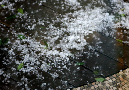 Hailstones are seen on a street in Shanghai, east China, on June 7, 2008.