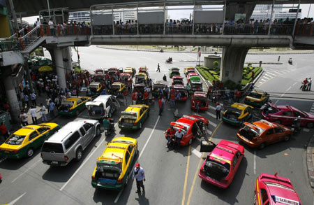 Protesters block traffic in Bangkok during mass rally