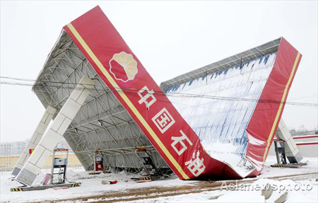 Gas station collapses amid heavy snow