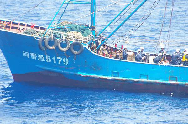 Chinese boat crew held in Japan on way home