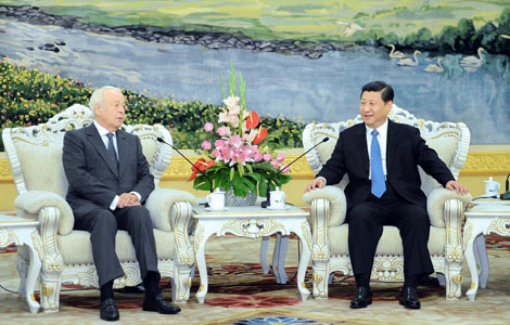 Xi pledges closer cooperation with France