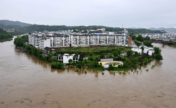 E. China downpours cause heavy damage