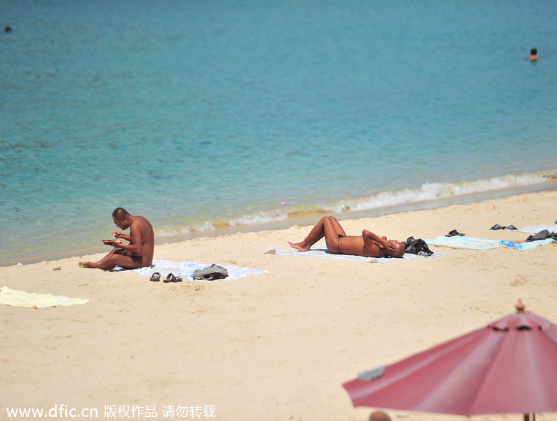 Two detained for swimming, sunbathing in the nude