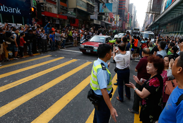 Cheers for HK police as barricades removed