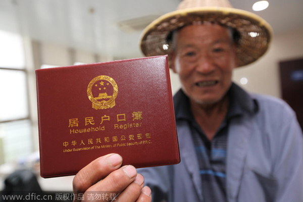 Four regions to scrap urban-rural '<EM>hukou</EM>' distinction