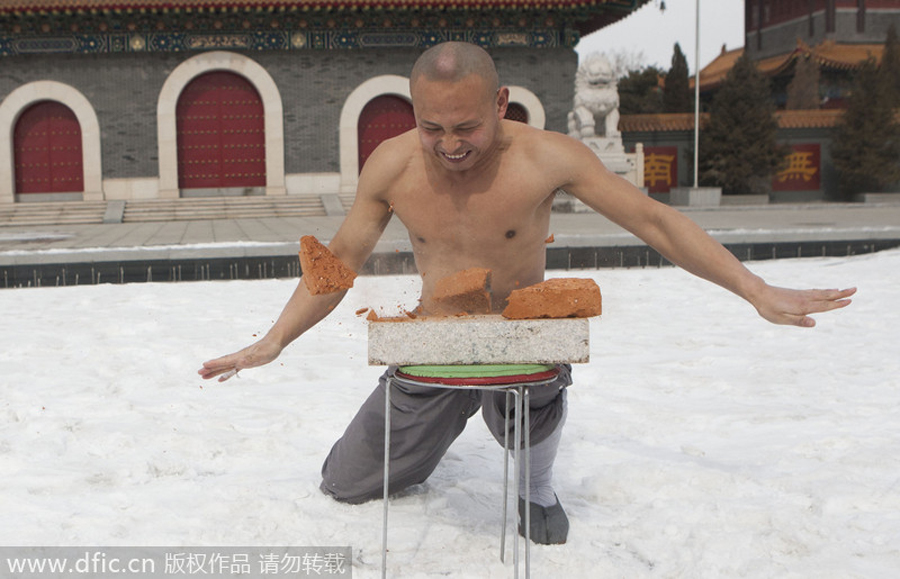 Buddhist monk breaks brick in kung fu
