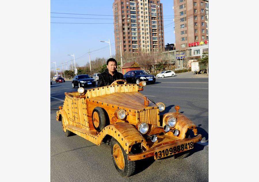 Chinese man makes antique car out of wood