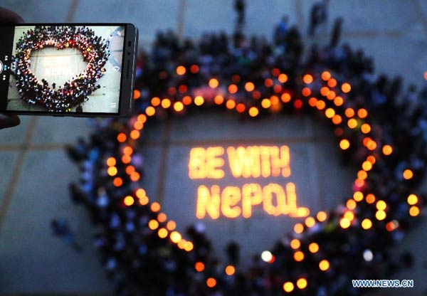 Students pray for people trapped in Nepal earthquake