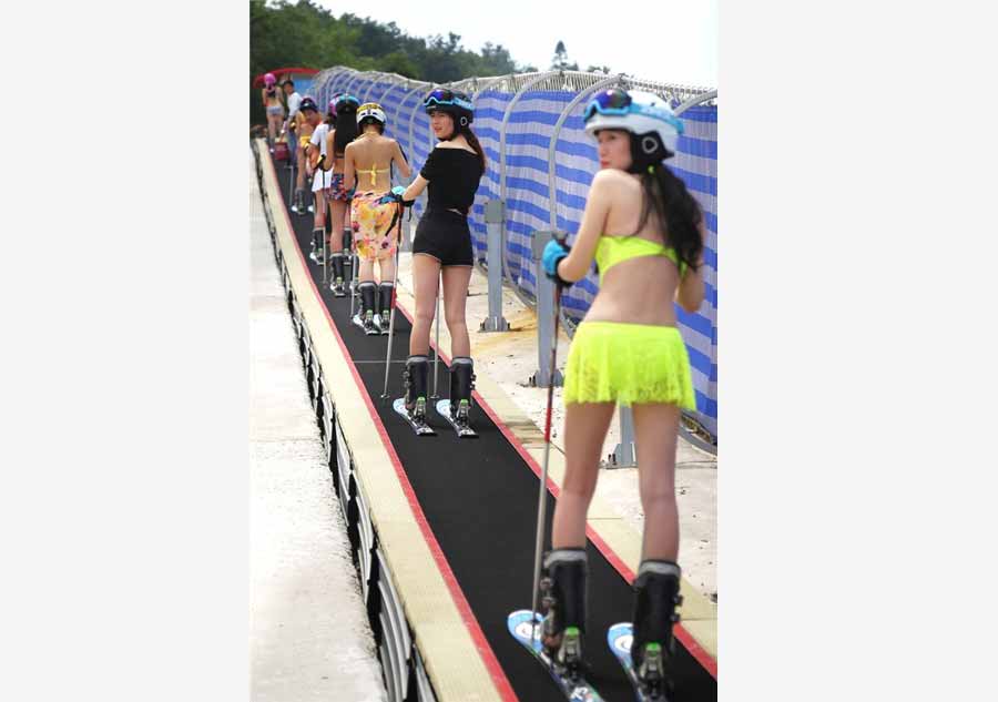 Models in bikinis turn ski resort hot