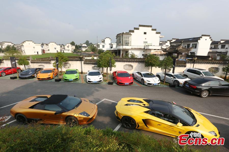 High-end sports cars rally in ancient town