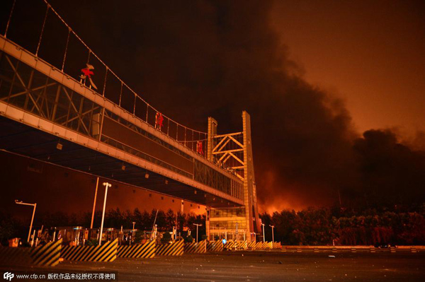 Explosions in China's Tianjin port area kill 17