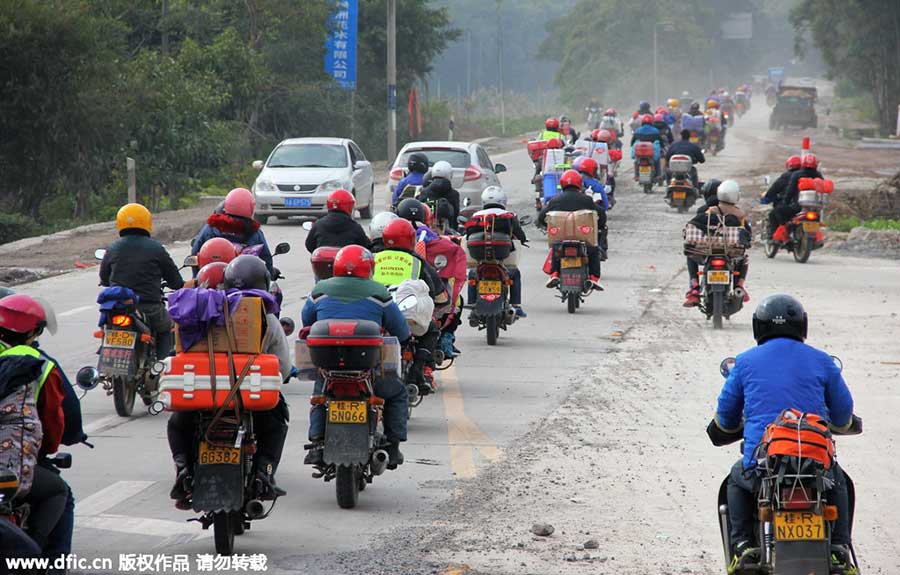 Migrant workers riding motorcycles home for Spring Festival reunion