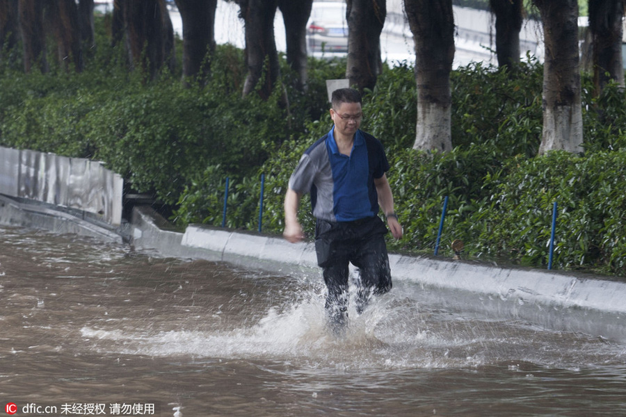 Heavy rains flood streets in Guangzhou