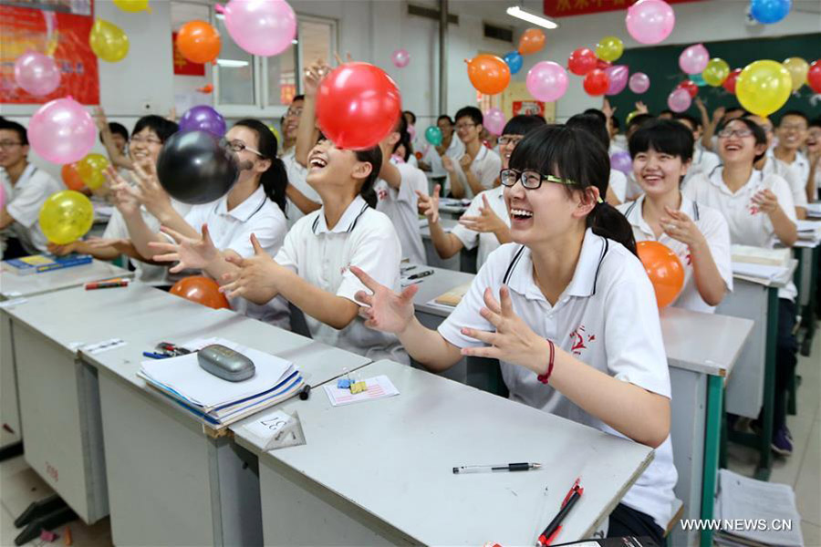 Balloons, paper planes and massages help students relax before college exam