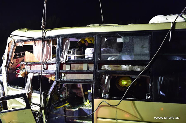 Bus rushes out of expressway in North China, 26 killed