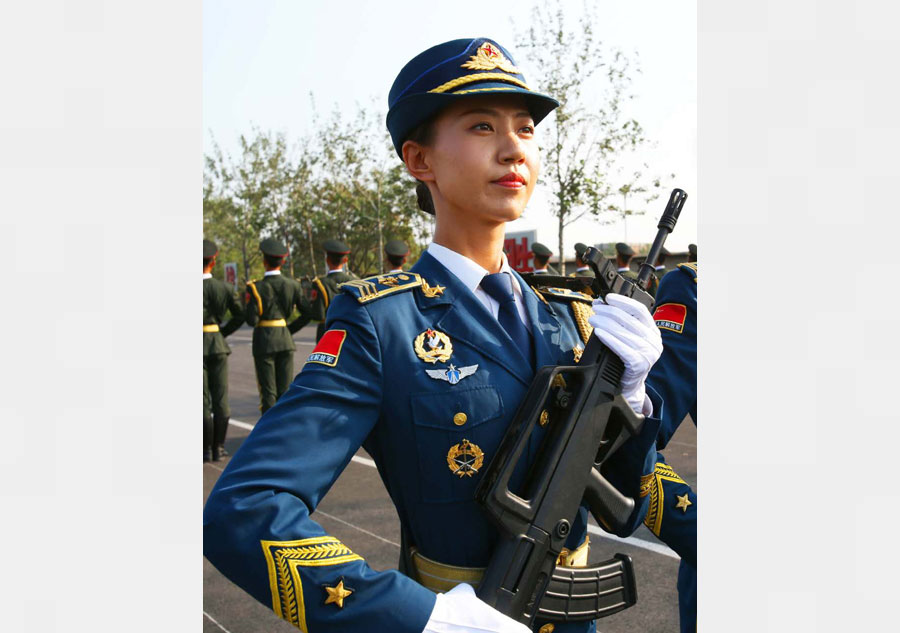Marching with honor: Women soldier carrying the flag