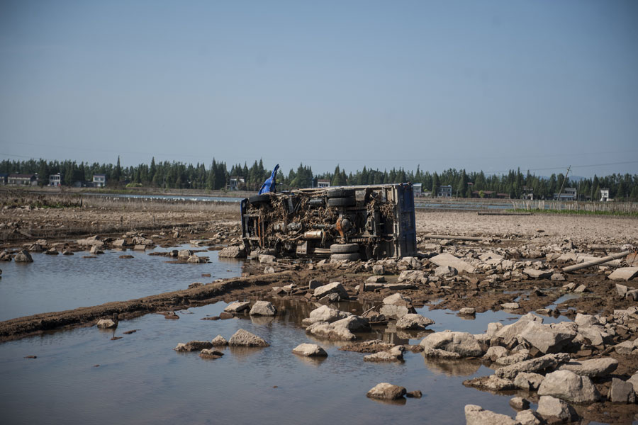 Residents sacrifice their vehicles to stop flood waters