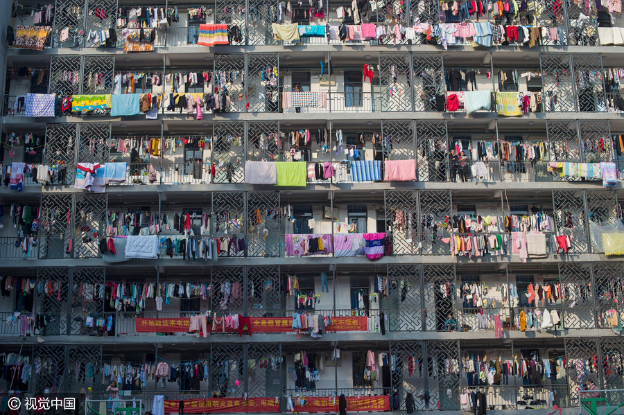 Students dry quilts and clothes in winter sunshine