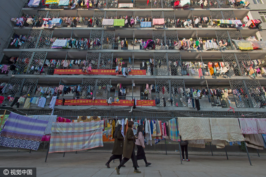 Students dry quilts and clothes in winter sunshine