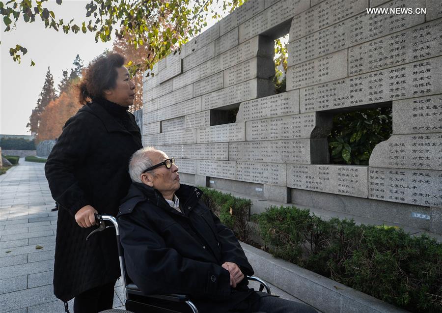 People mourn family members ahead of National Memorial Day for Nanjing Massacre Victims