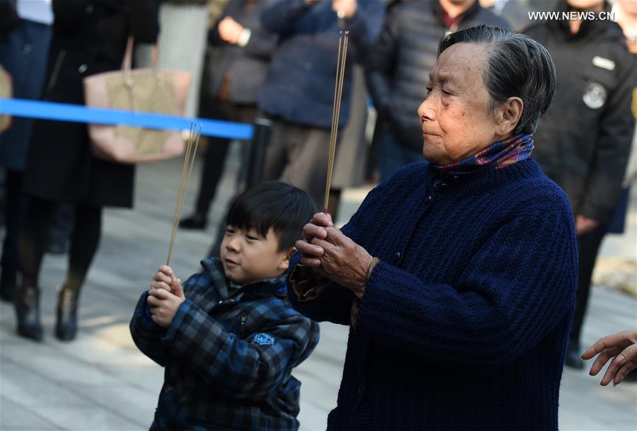 People mourn family members ahead of National Memorial Day for Nanjing Massacre Victims