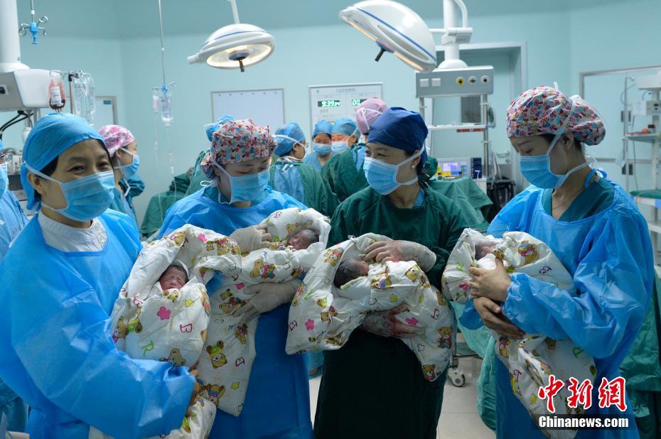 Extremely rare identical quadruplets born