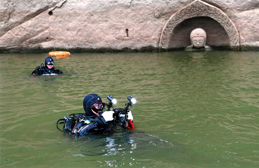 Ancient Buddha found as water level of reservoir lowers in E China