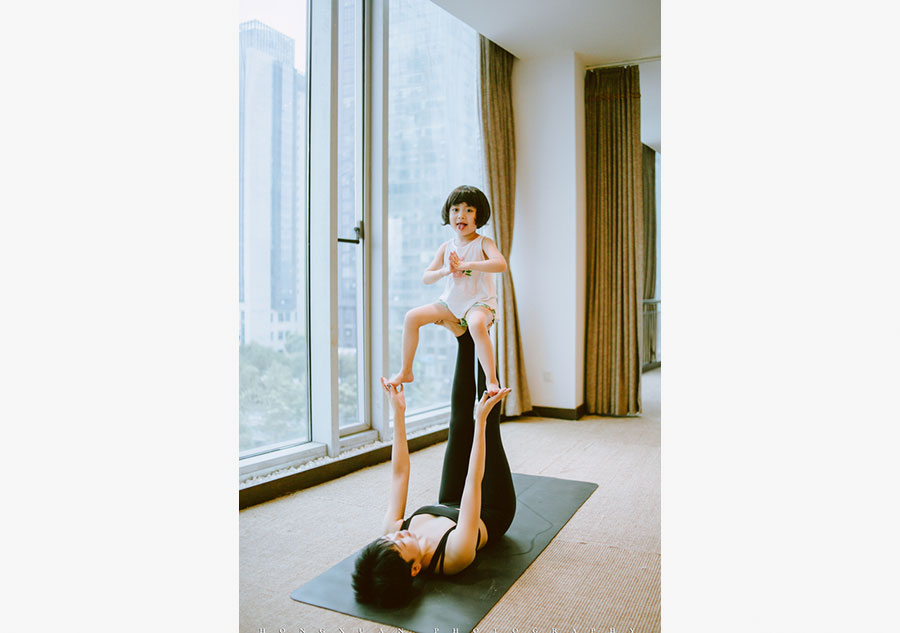 Little yogi practices yoga with 'guru' mother
