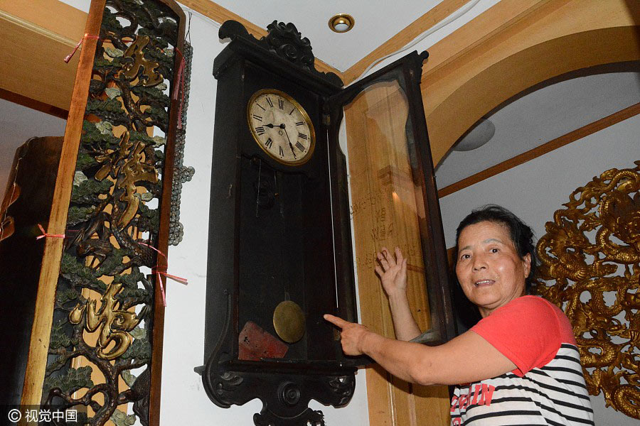 Thousands of clocks decorate old couple's home in Northeast China