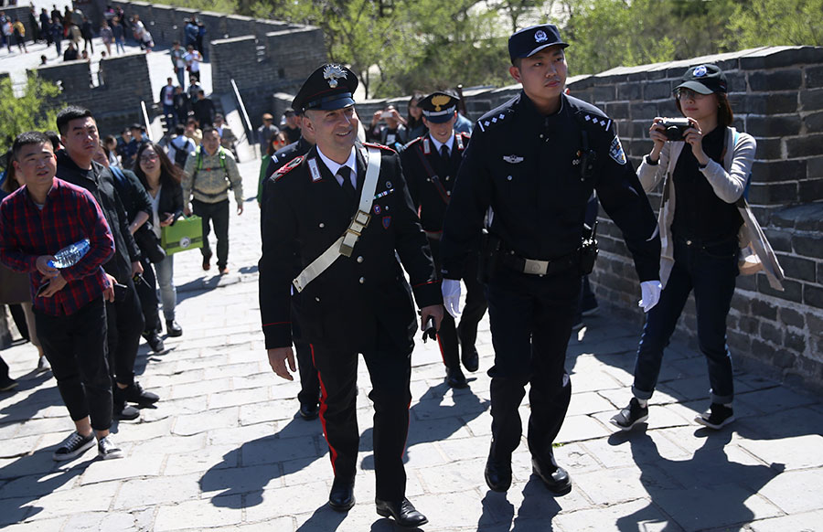 Italian police officers walk beats on Great Wall