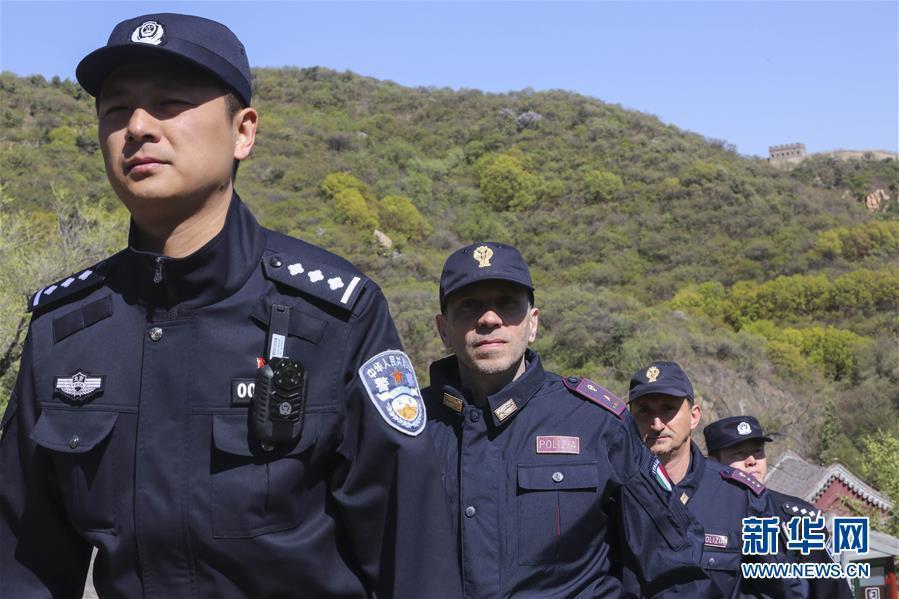 Italian police officers walk beats on Great Wall