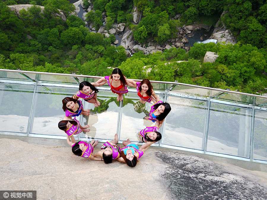 Models catwalk in bikini on 1,000-meter-high mountainside
