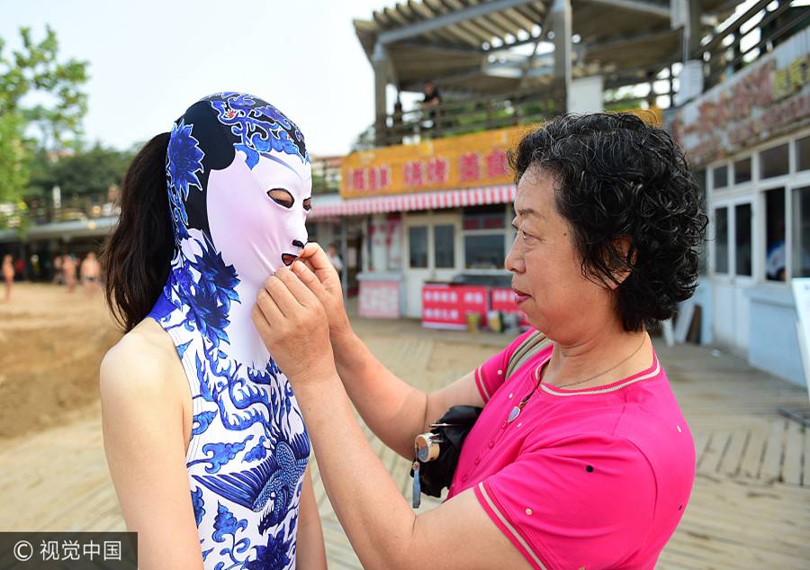 'Facekini' beauties attract plenty of attention at the beach