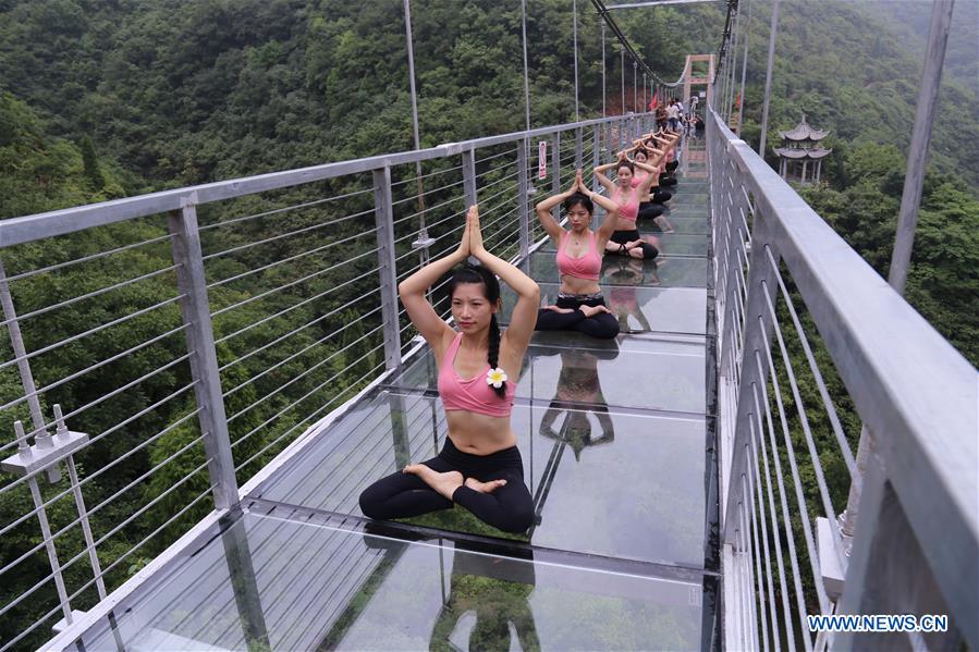 Yoga practiced on suspension bridge