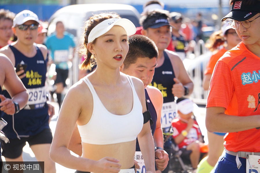 Runners compete during 2017 Beijing Marathon