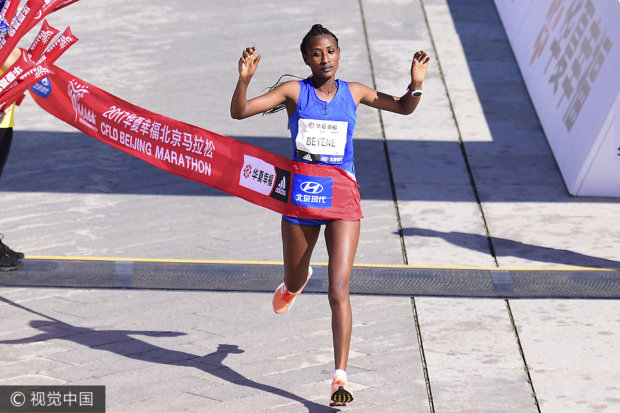 Runners compete during 2017 Beijing Marathon