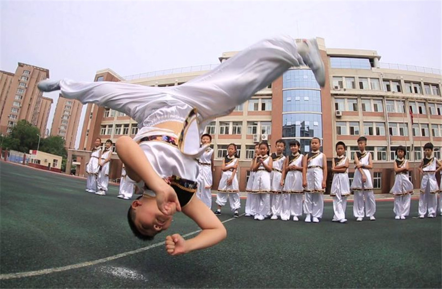 Students practice martial arts during class break