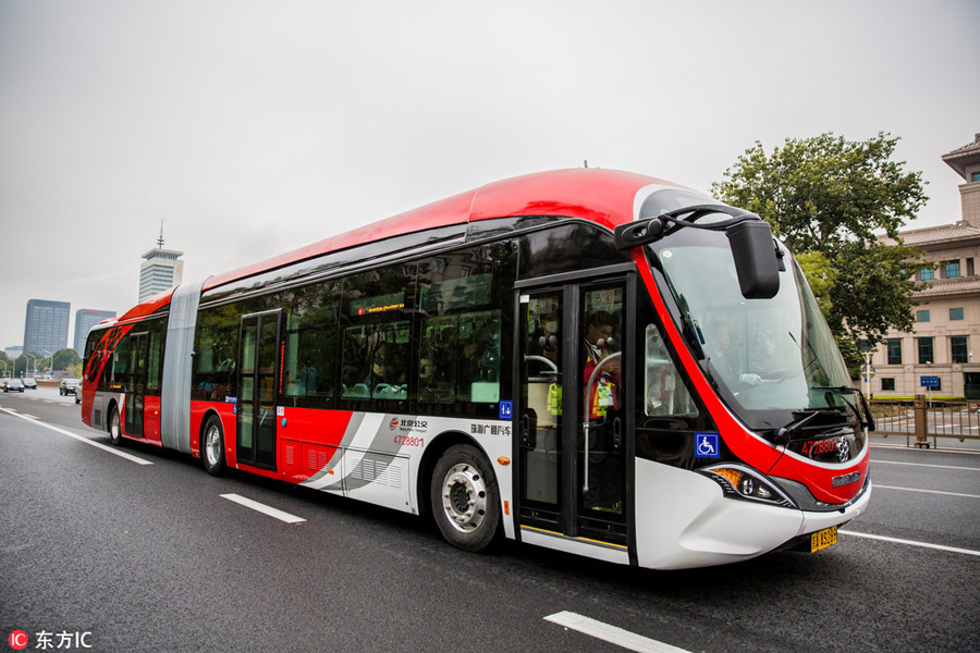 10 electric 'Chinese red' buses hit the roads in central Beijing