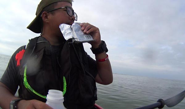 Man kayaks along China's coastline