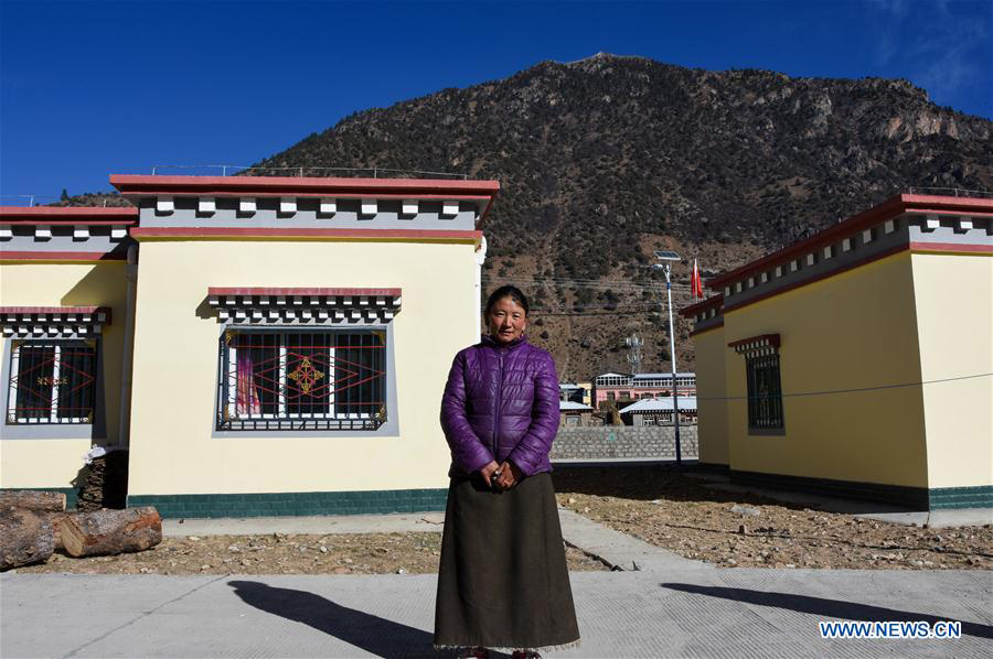 Impoverished villagers in China's Tibet move into new houses