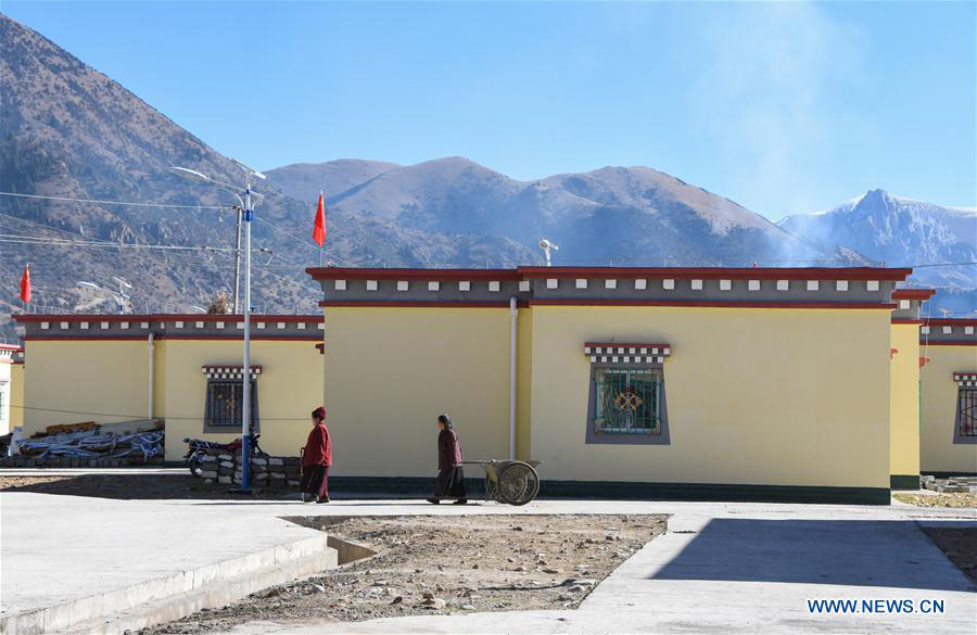 Impoverished villagers in China's Tibet move into new houses
