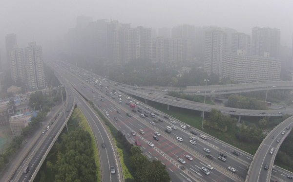 Beijing to cut pollutants discharge by a third during APEC