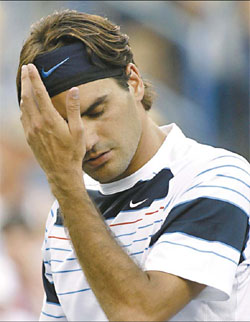 Federer stunned on day of upsets