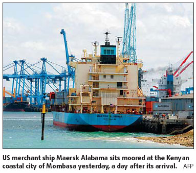 Warships track American hostage floating to Somalia